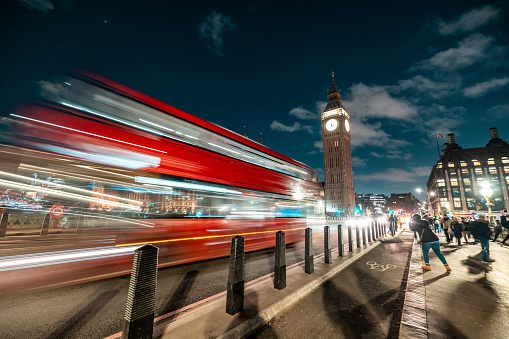 London, red bus and Big Ben at night, long exposure