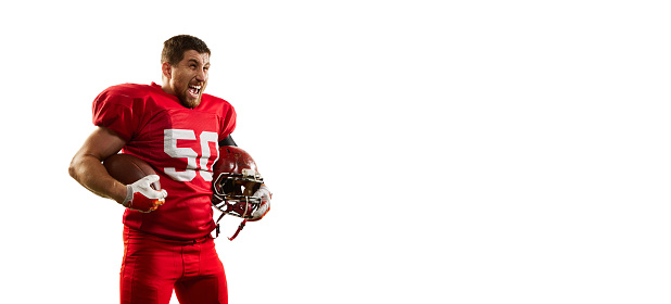 Winner emotions. Flyer with professional american football player in sports uniform and protective helmet isolated over white background. Sport, team, competition, championship concept