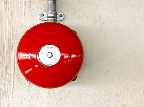 Close-up of a active fire alarm bell. An audible stimuli to alert when alarm system is triggered