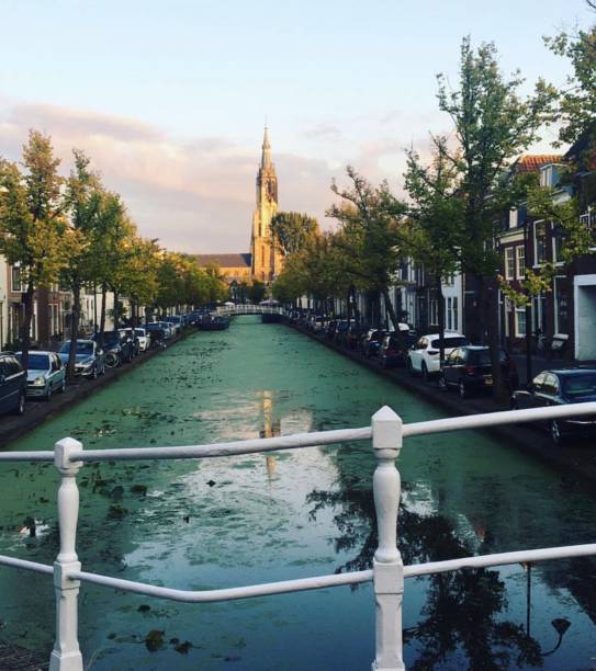 istock Beautiful Delft canal in a sunny day 1464118518
