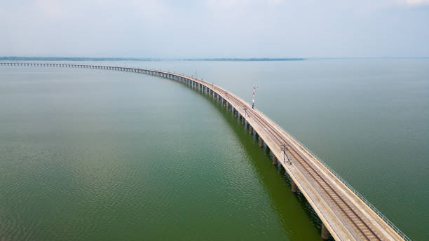 istock train tracks through the lake Thailand attractions 1464118767