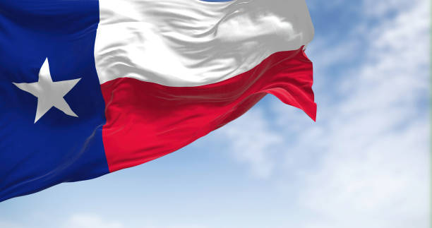 istock The Texas state flag fluttering in the wind on a sunny day 1464119115