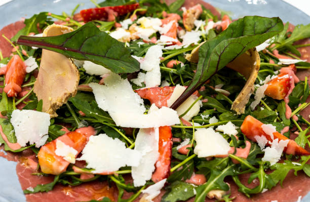 istock Beef carpaccio with parmesan cheese and green sprouts 1464119477