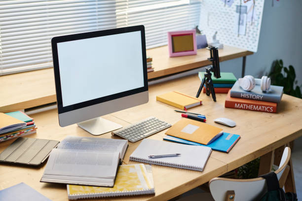 istock Workplace with computer monitor and books 1464120947