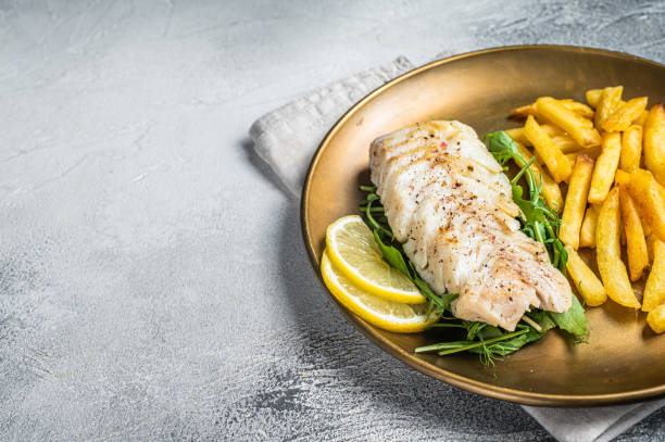 istock Fried cod fish fillet served with french fries. White background. Top view. Copy space 1464121218