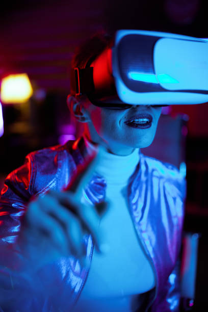 istock happy elegant business woman in virtual reality goggles 1464121221