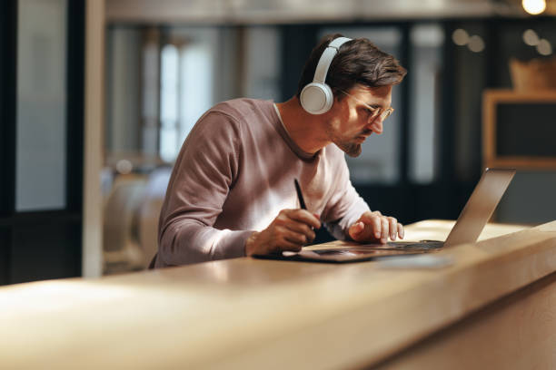 istock Graphic designer busy with a project in a cafe 1464121623