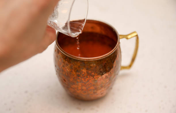 istock Making alcohol drink with shot glass in cup 1464122421
