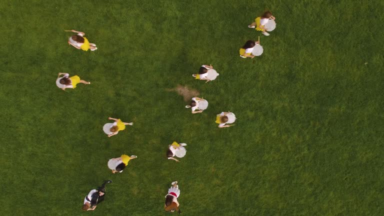 CHORTKIV, UKRAINE - AUGUST 22, 2019: High school football cheerleaders training