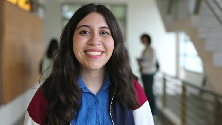 Head and shoulders portrait of teenage girl on campus