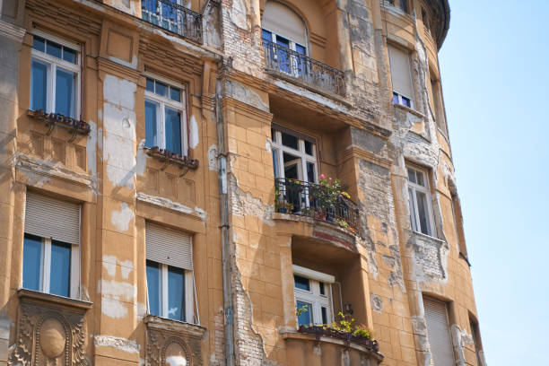 An old building with peeling paint in a European city