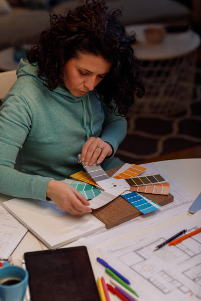 istock Interior Designer Choosing Samples Of Wall Paint 1464127453
