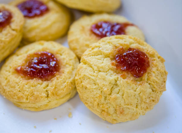 Close-up of freshly baked strawberry jam butter cookies stock photo