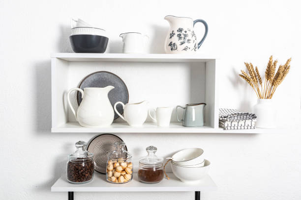istock beautiful white shelves with kitchen utensils on a white textured wall. kitchen interior in white tones. front view. ecologically clean kitchen. 1464132466
