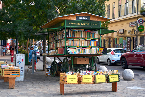A bookstall from an old cart on a city street. Budapest, Hungary - 08.25.2022