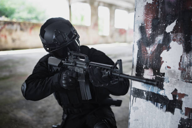 istock Young man scouting building in special force gear 1464133775