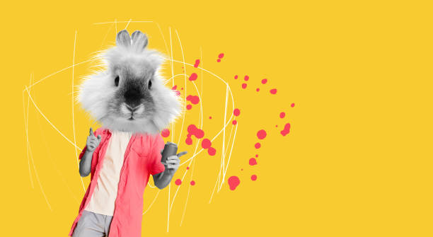 One person of aged 20-29 years old who is beautiful with black hair generation z female photography standing in front of white background wearing costume who is bizarre who is taking a selfie and using mobile phone and wearing wearing a rabbit mask mask