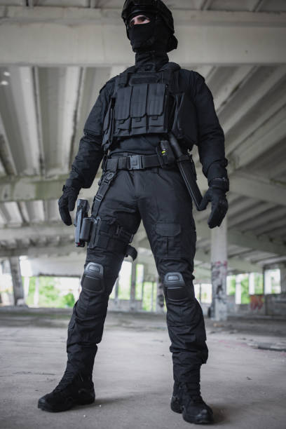 istock Young man standing in special force gear 1464135187