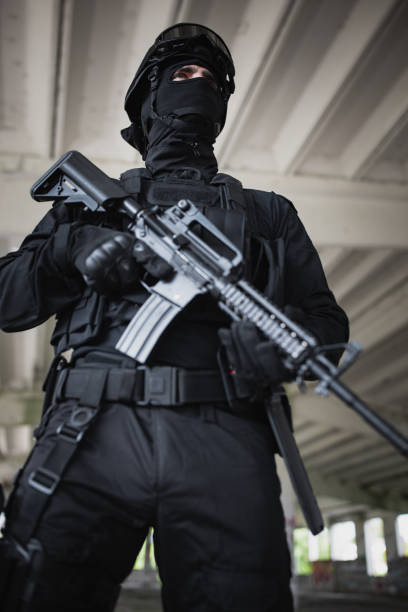 istock Young man standing in special force gear 1464135294