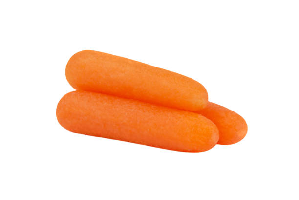 istock Peeled baby carrots isolated on a white background. 1464135344