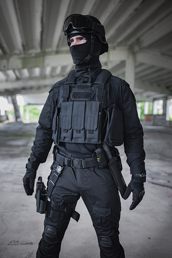 Young man standing in special force gear