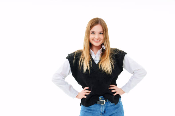 istock a blonde with sequins on face in a black knitted vest on a white background. 1464135942