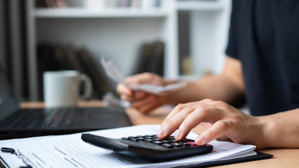 istock Close-up Man is calculating house bills cost 1464135980