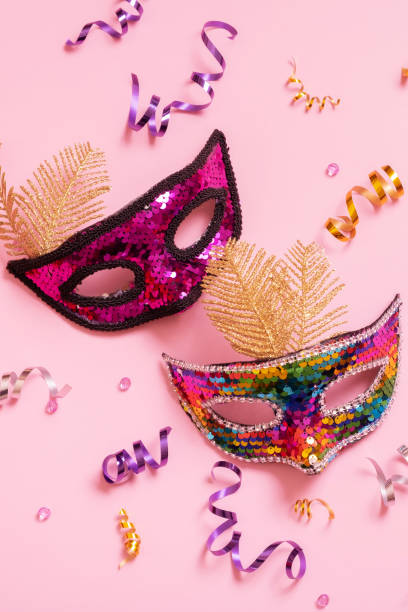 istock Festive face mask for carnival celebration on colored background 1464137529