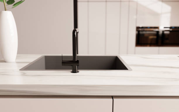 istock White marble kitchen counter, with black faucet 1464138091