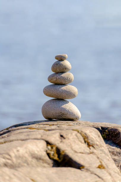 istock Pyramid of stones. Unstable balance of stone objects. 1464139689