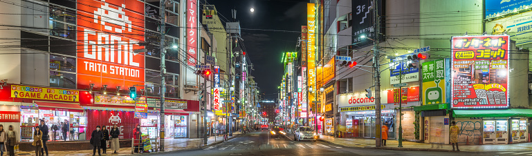 Neon lights and crowded streets of Denden Town at night in the heart of Osaka, Japan’s vibrant second city.