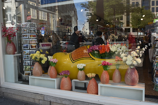 Amsterdam, Netherlands- 09-18-2022- A huge wooden shoe is seen inside a Dutch souvenir shop.