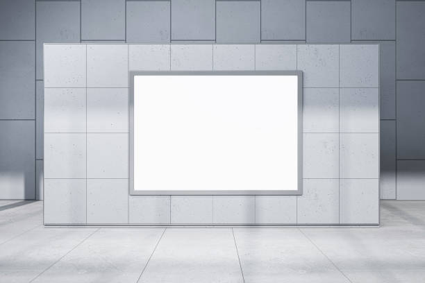 istock Front view on blank white poster with space for your logo or text on sunlit concrete wall partition, outdoor advertising concept. 3D rendering, mock up 1464147184