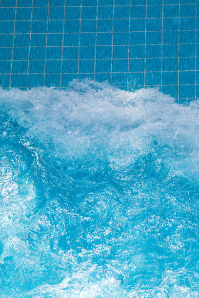 istock Artificial wave in the pool on a blue background, close-up 1464147323