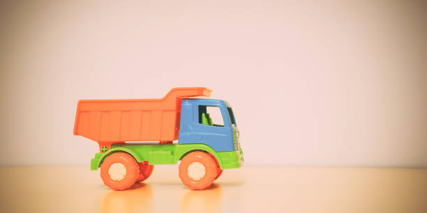 istock Retro plastic colorful truck toy with orange bodywork. 1464160717