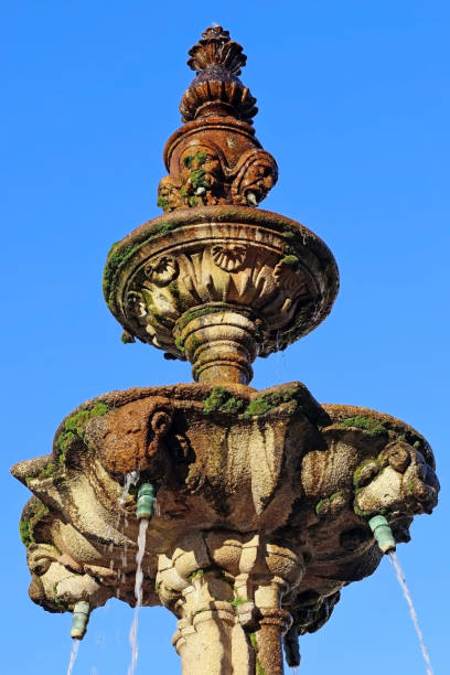istock An ancient stone fountain pouring water 1464161200