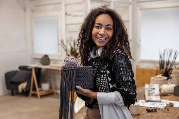 istock Joyful young craftsperson posing for the camera in her studio 1464161333