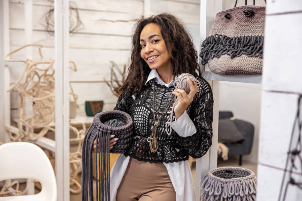 istock Joyous craftsperson standing among her handcrafted items 1464161337