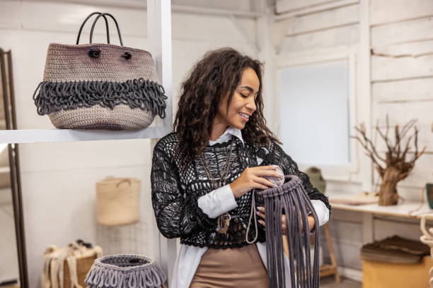 istock Joyous cute young craftswoman in her workshop 1464161362