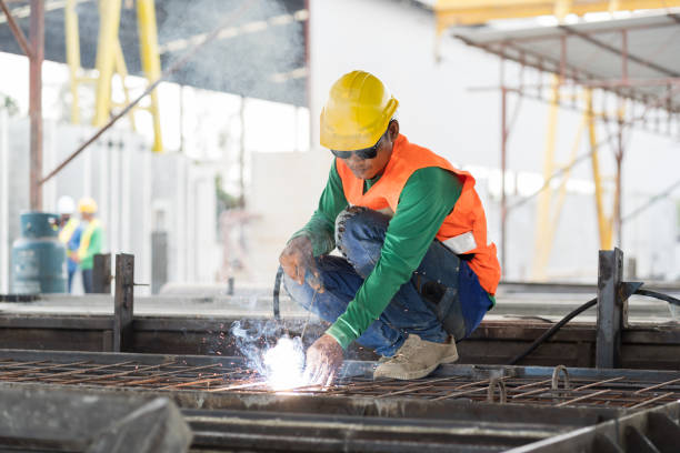 istock Welder welding worker working in the construction site. Asian welder welding workers at work 1464165192