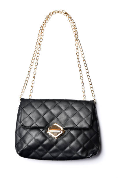 Leather women's handbag with a chain strap on a white background. Fashionable women's clutch.