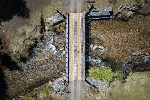 Wooden bridge over a river at China Muerta national reserve in La Araucania region, southern Chile
