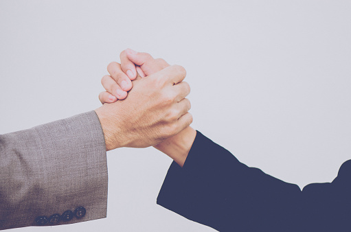 Business partnership meeting. Picture businessmans handshake. Successful businessmen handshaking after good deal. Horizontal, blurred background