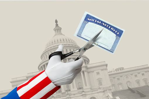 Uncle Sam uses a pair of scissors to cut a Social Security card in front of the U.S. Capitol building.