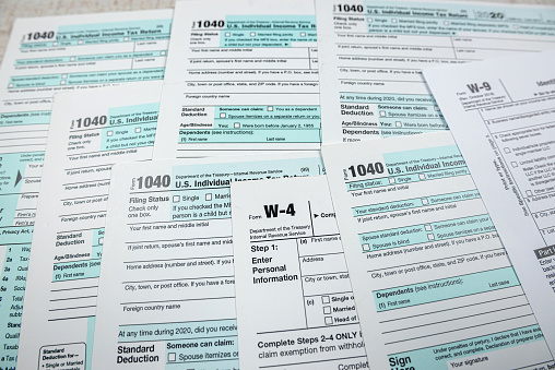 closeup of 1040 US personal income tax form on desk. Time for tax. Accounting concept
