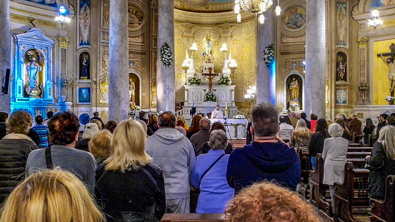 Buenos aires, Argentina - April 17, 2022 : Crowd at immaculate conception parish of belgrano mass, buenos aires, argentina