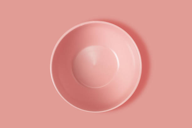 istock Pink plate on a pink background. View from above. Concept 1464181189