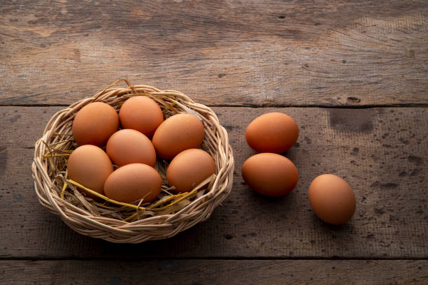istock Heap of Chicken eggs on wicker basket 1464182029