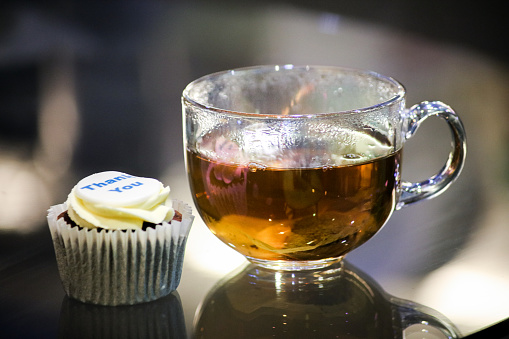 Cupcake and a hot cup of tea