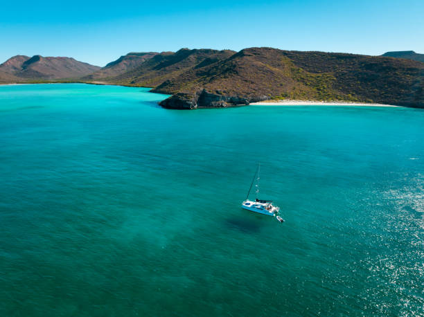 istock Lone sailboat in the tropics 1464185111